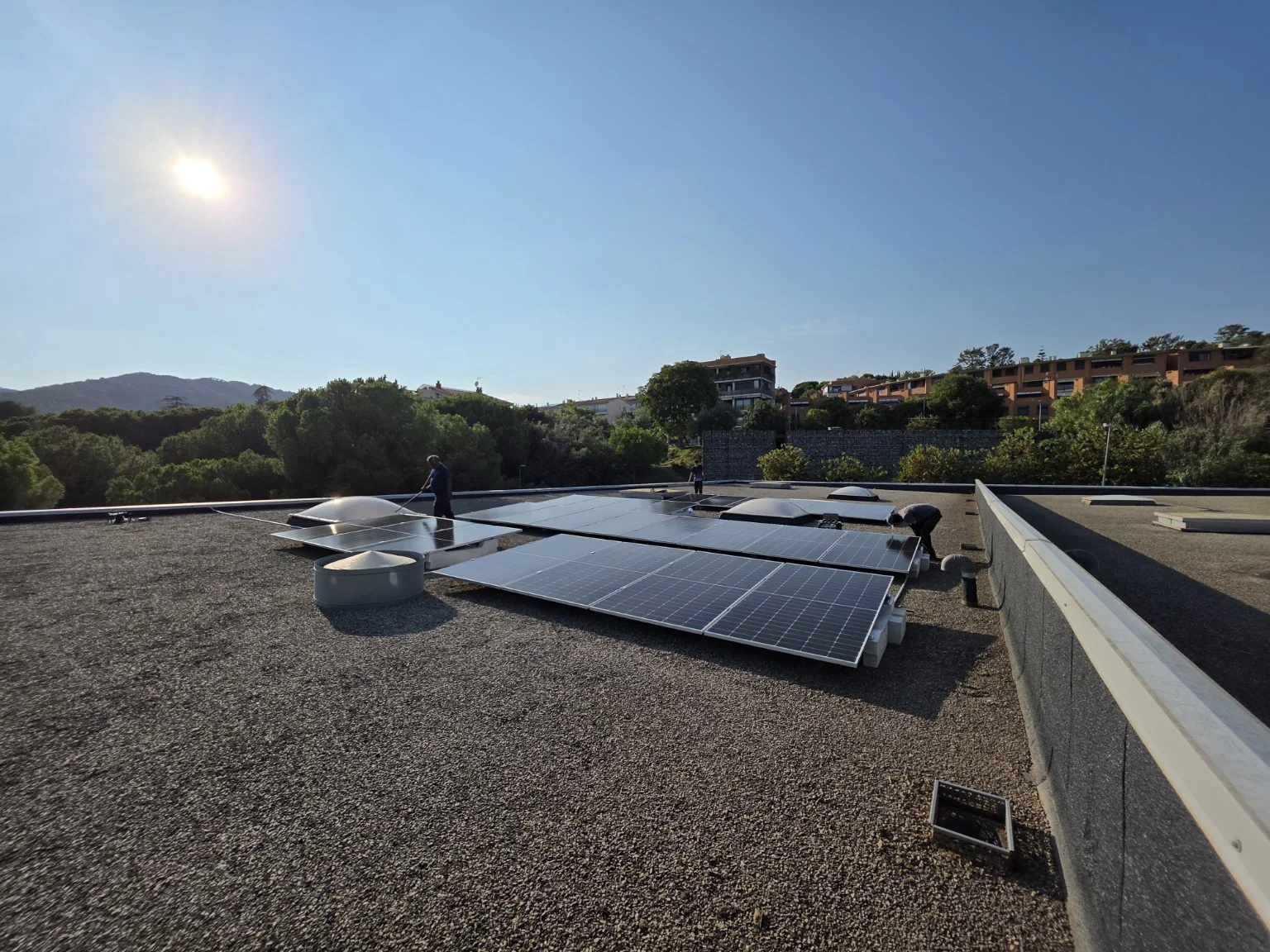 Installing solar panels on the Projekta roof in August 2025