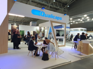 🥇 Custom exhibition stand for Qualicaps_at_CPHI_2023, produced by ProjeKta stand builders with innovative branding and structure.