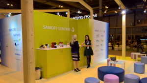 🥇 Custom exhibition stand for Sanofi_Genzyme, produced by ProjeKta stand builders with innovative branding and structure.