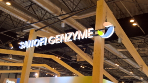 🥇 Custom exhibition stand for Sanofi_Genzyme, produced by ProjeKta stand builders with innovative branding and structure.