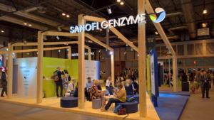 🥇 Custom exhibition stand for Sanofi_Genzyme, produced by ProjeKta stand builders with innovative branding and structure.