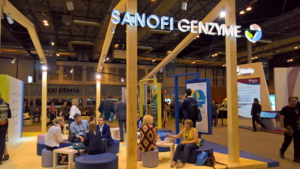 🥇 Custom exhibition stand for Sanofi_Genzyme, produced by ProjeKta stand builders with innovative branding and structure.