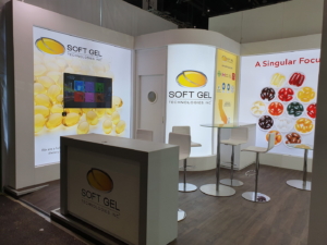 🥇 Custom exhibition stand for SoftGel_Technologies_Inc_at_Vitafoods_Geneva, produced by ProjeKta stand builders with innovative branding and structure.