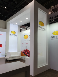 🥇 Custom exhibition stand for SoftGel_Technologies_Inc_at_Vitafoods_Geneva, produced by ProjeKta stand builders with innovative branding and structure.