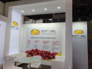 🥇 Custom exhibition stand for SoftGel_Technologies_Inc_at_Vitafoods_Geneva, produced by ProjeKta stand builders with innovative branding and structure.