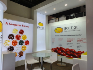 🥇 Custom exhibition stand for SoftGel_Technologies_Inc_at_Vitafoods_Geneva, produced by ProjeKta stand builders with innovative branding and structure.