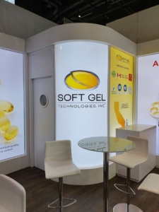 🥇 Custom exhibition stand for SoftGel_Technologies_Inc_at_Vitafoods_Geneva, produced by ProjeKta stand builders with innovative branding and structure.